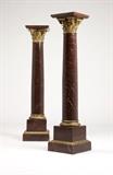 Lot# 1042 A pair of rouge marble & gilt bronze pedestals Late 19th / early 20th century, each with a square platform over a Corinthian column on a stepped square base, 2 pcs, each 55'' H x 12.5'' W x 12.5'' D, est: $3000/5000