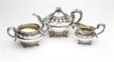 Lot# 1103 A Victorian sterling silver tea set
 
1837 - 1842, London, makers mark of Edward Barnard and Sons, an assembled partial service comprising: a teapot dated 1837 (6'' H x 11.25'' W x 6.75'' D), a sugar or waste bowl dated 1838 (4.25'' H x 8.75'' W x 6'' D), and a milk jug dated 1842 (4.5'' H x 6.75'' W x 4.5'' D), 3 pcs, gross weight 45.1 oz troy tw approximately, est: $600/900