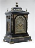 Lot# 1106 A large English bracket clock Second half 19th century, signed to the circular silvered dial ''Ollivant and Botsford / Manchester'', with black Roman numeral hours, surmounted by three subsidiary dials for chime selection (Westminster chimes and Eight Bells), speed adjustment and chime / silent, beneath an arched beveled glass aperture within a gilt bronze-mounted ebonized wood case enclosing the triple train chain and fusee movement, with anchor escapement, eight bells, and coiled gong, with key, with plaque affixed to front of case engraved ''Presented to James MacLaren / Pres. Rugby Union 1882 - 1884 / by his football friends in recognition of valued service rendered to the Rugby Game / Especially in the North of England / Nov.r 1884'', 29'' H x 18'' W x 12.25'' D, est: $4000/6000