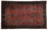 Lot# 1115 A Fereghan Sarouk rug Circa 1920s, wool on cotton foundation, the field red-ground with detached floral sprays within a blue border, 6'6'' H x 4'3'' W, est: $800/1200