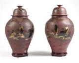 Lot# 1119 A pair of painted & lacquer-decorated porcelain jars Circa 1900, the domed covers and baluster-form bodies decorated with Japanese figures and buildings in a landscape on a matte red ground, 2 pcs, 30'' H x 18'' Dia., est: $3000/5000