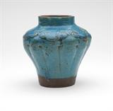 Lot# 1120 A Chinese earthenware vase Probably 19th century, the lobed baluster-form body turquoise-glazed and with incised design to the shoulders, 4.5'' H x 4.25'' Dia., est: $500/700
