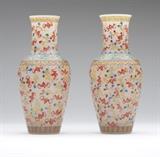 Lot# 1124 A pair of Chinese Peking glass vases Mid 20th century, spurious marks to base, each of baluster form with an attenuated neck, the opaque glass polychrome-decorated with bats and other motifs within floral and ruyi head borders, 2 pcs, each 8.25'' H x 3.5'' Dia., est: $400/600
