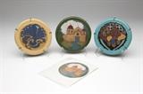 Lot# 1157 Three California Faience glazed ceramic tiles Circa 1920 - 1950, Berkeley, CA, each impressed ''California Faience'', each circular with molded and polychromed design, the first: stamped ''Compliments / S.A. Bruner Tile Co. / Christmas 1920'', depicting a Mission church on a green ground, the second: depicting a peacock on a buff-colored ground; the third: depicting mixed fruit and foliage on a turquoise ground; 3 pcs, each .5'' H x 5.25'' Dia., est: $400/600