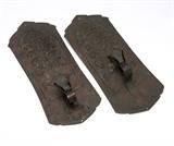 Lot# 1160 A pair of Arts and Crafts copper wall sconces Early 20th century, unsigned, apparently studio-made, each with a shaped backplate applied with a panel pierced with a stylized flower over a scrolled candlearm with a foliate socket, 2 pcs, each 13.5'' H x 5.5'' W x 2'' D, est: $400/600