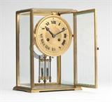 Lot# 1172 A French crystal regulator retailed by Tiffany & Co. Circa 1925, the dial marked ''Tiffany & Co.'' and ''France'', the backplate with Vincenti & Co. 1855 Medaille d'argent seal and further stamped ''Made in France'', ''A.1'', and ''640'', the engine-turned circular dial with black Art Deco style Roman hour markers, attached to a twin train movement, strikes on the hour and the half-hour, with mercury pendulum, within a rectangular case with beveled glass panels, on bracket feet, 10.5'' H x 7.5'' W x 5.5'' D, est: $800/1200