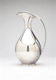 Lot# 1173 A Danish modern sterling silver pitcher by K. Fisker Circa 1950, designed by Kay Fisker (1893-1965) for A. Michelsen, Copenhagen, with maker's mark and signed ''Kay Fisker'', further marked ''Sterling / Denmark'', ''S'', ''1L'' and ''1.9'', the flared, compressed spout joined to the teardrop-shaped body with an arc handle, on a circular foot, 9.5'' H x 5.5'' W x 5'' D, 20.4 oz troy approximately, est: $4000/6000