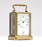 Lot# 1179 An early French brass carriage clock First half 19th century, the white dial with Roman numeral hours and circular minute track, with three hands, above a second dial for alarm, center sweep-seconds, within a brass and beveled glass case stamped to underside ''Brevete S.G.D.G. / H.A.'', marked to back plate ''L S'' with a spade, and stamped ''118'', with dual key, 5.625'' H x 3.125'' W x 2.75'' D, est: $500/800