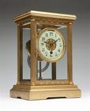 Lot# 1181 An early Boston Clock Co regulator carriage clock Late 19th / early 20th century, signed ''Boston Clock Co. / Boston / Pat'd Dec 28, 1880'', serial number 4048 S-658020- 0H, the door marked ''292B on back and ''292F'' on front, tandem wind movement, one arming airbrush which winds both times and strikes in right and left movement, the beveled glass plate and gold plated rectangular flat top case with fluted columns enclosing an off-white enameled and gold plated dial with black enamel Arabic numerals, raised on a rectangular plinth on bracket feet, 10.5'' H x 7.5'' W x 5.75'' D, est: $600/900