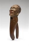 Lot# 1204 An American folk art carved & painted wood nutcracker Late 19th / early 20th century, carved in the form of an African man or woman's head, 9'' H x 2.75'' W x 3.5'' D, est: $400/600