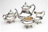 Lot# 1210 A Reed & Barton 'Georgian Rose' sterling silver tea set
 
1947 - 1948, Taunton, MA, marked ''Reed & Barton / Sterling / 670 / Georgian Rose'', comprising: a teapot (9.25''H x 10.5''W x 5''D), a covered sugar bowl (6.25''H x 7.5''W x 4''D), a cream jug (5.25''H x 5.5''W x 3''D) and a waste bowl (4''H x 5.5''W x 4''D), not monogrammed, 4 pcs, gross weight 57.2 oz troy tw approximately, est: $900/1200