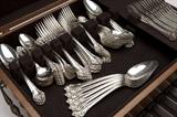 Lot# 1209 A Reed & Barton ''L'Elegante'' sterling silver flatware service Introduced 1900, Taunton, MA, with maker's mark, further marked ''Sterling'' and ''Pat. Oct. 11 1898'', and with retailer's mark ''Frank Herschede'', comprising: 12 blunt steel-bladed hollow handle knives (10''), 12 blunt steel-bladed hollow handle knives (9''), 12 flat handle butter spreaders (5.875''), 12 forks (7.75''), 12 forks (7''), 12 salad forks (6.125''), 12 oyster forks (5.5''), 12 teaspoons (5.75''), 12 oval soup / dessert spoons (7.125''), 12 round bowl bouillon soup spoons (5.25''), 5 serving spoons (8.25''), 1 steel-bladed hollow handle carving fork (10.875''), and 1 steel-bladed hollow handle carving knife (13.5''), each monogrammed ''M'', 127 pcs, together with a wooden canteen, weighable sterling 124.3 oz troy tw approximately, est: $1800/2400