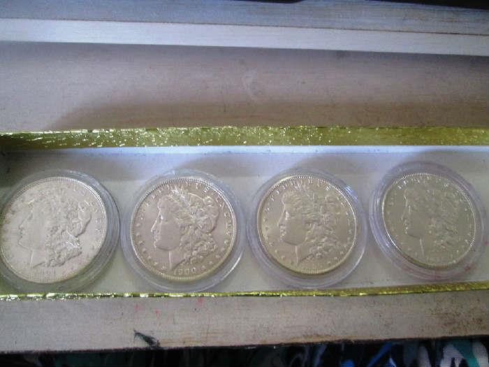 Antique silver dollars in plastic holders