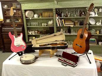 musical instruments. Vintage Guitar banjo violin flute and pink electric guitar with amp