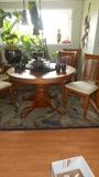 Round Oak Pedestal table with a 24" leaf $150.00