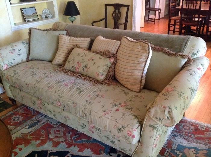 large floral sofa with pillows