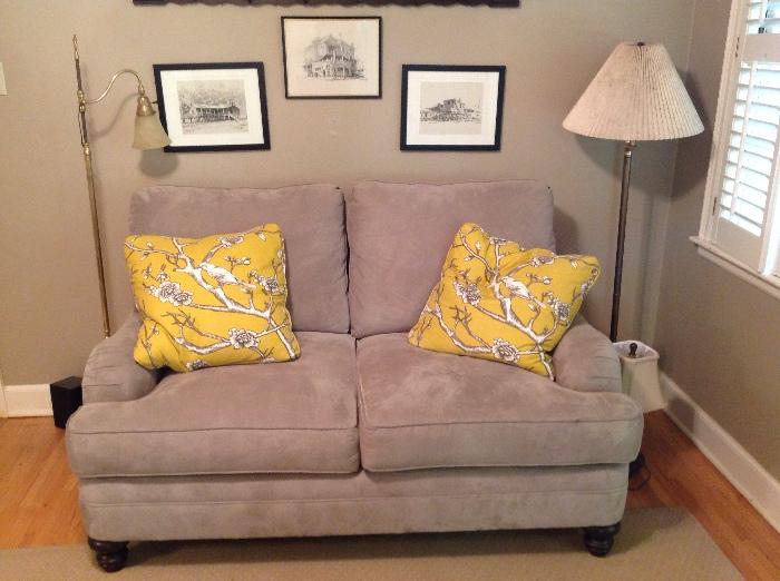 Grey sofa, prints, floor lamps