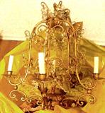 Old Chandelier found in the attic-I will be cleaning it up this week, the gold gilded metal is in a very pretty designing, i have mounting parts and I believe all of the crystals are here. Thanks for your patience!