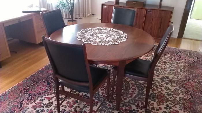 Nesjestranda Møbelfabrik dining room table that comes with four leaves and four chairs.