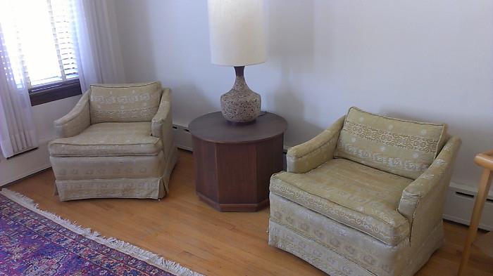 Two mid-century armchairs with a Kent Coffey-style end table and cork lamp.