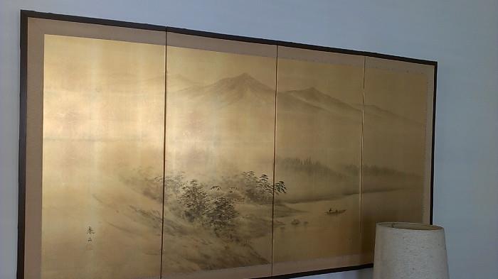 Japanese print on four-panel screen with brass details on the frame and a lace-covered back. 