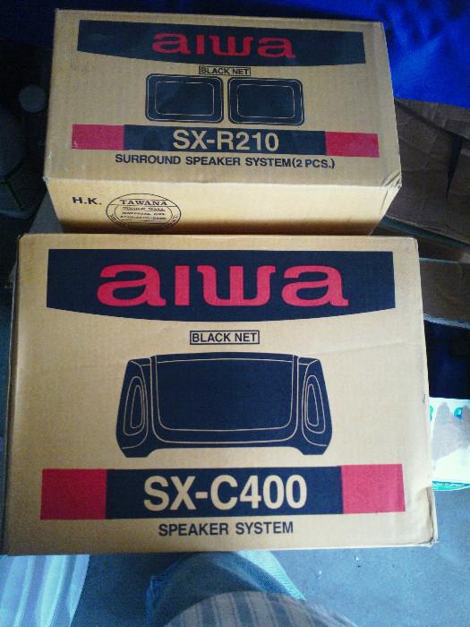 Both speaker sets are new in original box