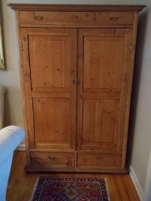 Antique pine cabinet with top drawer and two bottom drawers, clients installed shelving, but has original hanger hooks inside - purchased in Texas