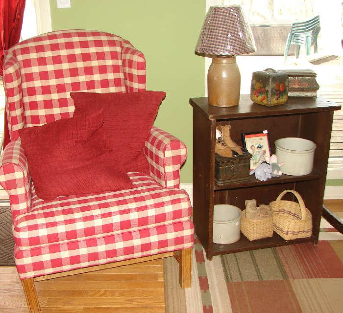 Upholstered chair, stoneware, baskets, old tins, crock lamp