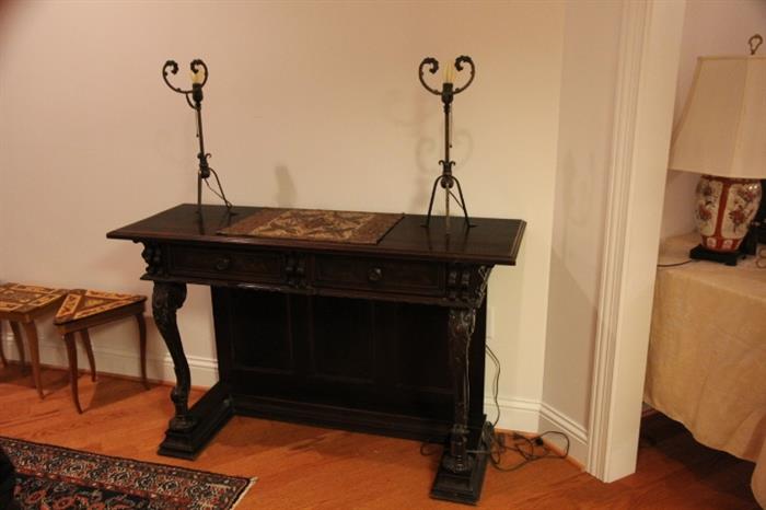 Pair of Arts and Crafts era forged lamps on pier table