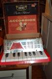 Emenee Musical Toys Golden Piano Accordion with original case.
