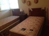 Twin beds and vintage oak chest