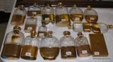 All these Flasks are Gold, the one on the right bottom is a Cartier 18kt gold