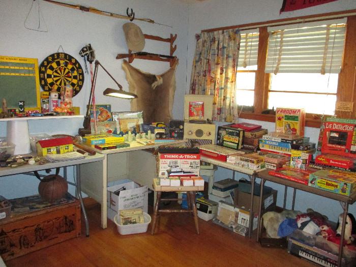 This is a fun room.  If you grew up in the 50s you will find some things that will take you back to your childhood.  Everything is in nice condition.  Vintage Deer Slayer Ben Pearson Static Recurve Bow, Duncan Yo Yo's, (Flip Toy and Beginner's) Kenner's Motorized Building Set and as you can see, too much to list!