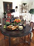Neoclassical style round dining table, pair of etageres with glass shelves, Dresden plates,