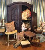 Carved cupboard, 19th century european. Custom pillows and needlepoint rugs.