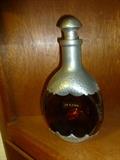 Vintage hammered aluminum and amber glass decanter