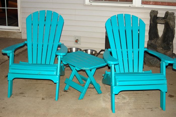Teal adirondack chairs (four with foot rests and tables)
