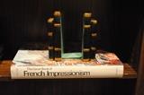 A very large book on French Impressionism and a pair of book ends