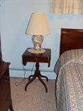 Cute little drop-leaf end table & shell lamp.