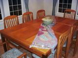 Beautiful Teak dinning set, like new condition with 8 chairs, and large pullout leaves at each end