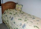 One of pair of twin beds with pillow top mattress, like new