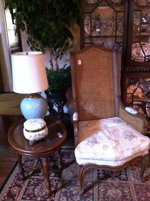    double caned chair; small oval table; decorative hinged box; lovely lamp