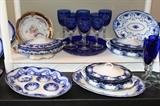 Wood & Son ironstone platter;  Flow blue butter pats;  New Wharf Pottery "Paris" flow blue platter;   Grindley & Co. "Beaufort" flow blue oval platter, Unmarked flow blue covered casserole; Stoke on Trent covered casserole;  Other Grindley flow blue platter
