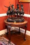 Frederic Remington Bronze "Through the Rye", 30" tall x 26" wide x 18" deep;  Mahogany chippendale style occasional table