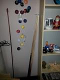 Pool sticks and game room decor