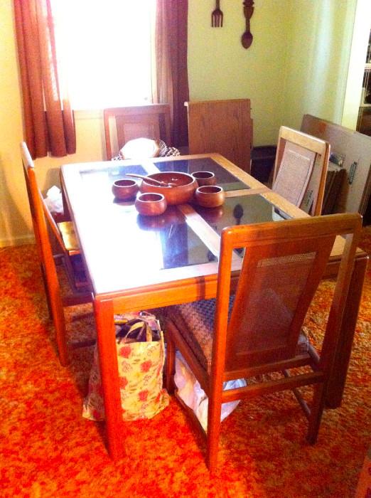 Vintage wood and smoked mirror top dining table with cane back chairs