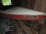 This is the hull of the racing boat. The steering wheel and the motor are all in good shape as well as the boat.