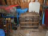 this phot is of the garage area. Shown is a domed top trunk but on the right side you can see the Goodyear outboard motor. The motor is from the 1920-40's. Mr Mcwethey ran a Goodyear store in Weedsport and built boats including the racing boat in this sale. The Goodyear motor is unusual and was used on a canoe by Mr. McWethy, the grandfather.