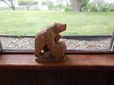 This carved bear in about 12" tall.
