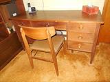 The desk and chair are maple